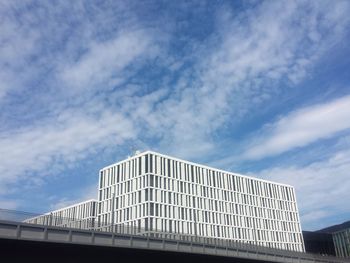 Low angle view of office building against sky