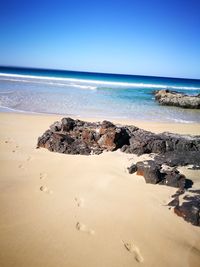 Scenic view of sea against clear sky