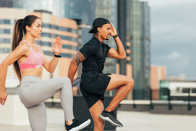 Portrait of young woman exercising in gym