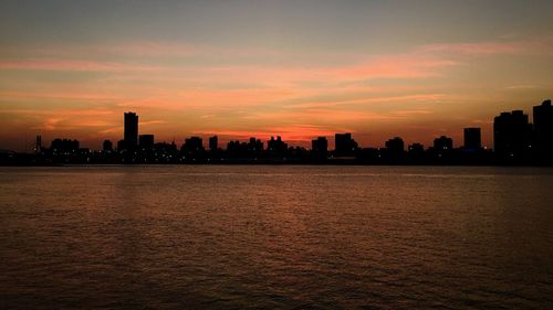 Silhouette of city at sunset