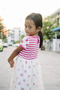 Portrait of girl standing outdoors