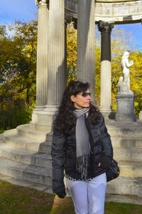 Woman standing by steps