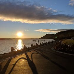 Scenic view of beach against sky during sunset