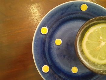 High angle view of lemon in glass on table