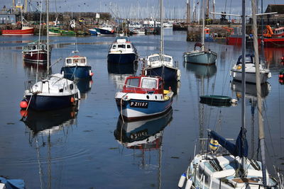 High angle view of boats moored at harbor