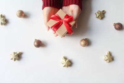 Directly above shot of christmas decorations on white background