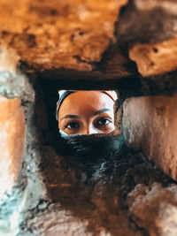 Close-up portrait of young woman looking away