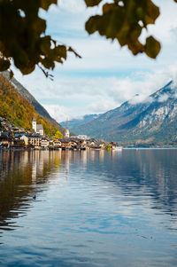 Scenic view of lake and mountains against sky