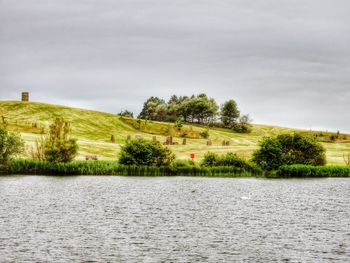 Scenic view of landscape against cloudy sky