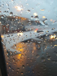 Close-up of water drops on airplane window