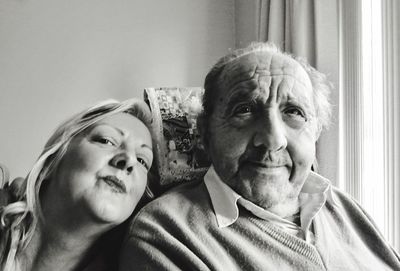 Close-up portrait of senior couple at home
