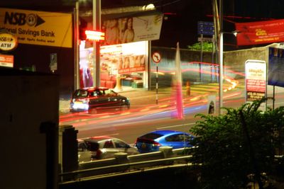 Light trails on road in city at night