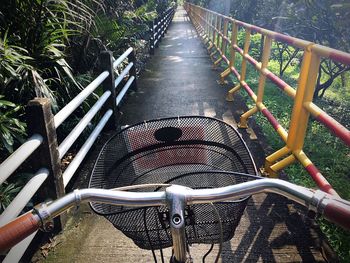 Bicycle parked against trees