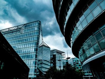 Low angle view of modern buildings against sky