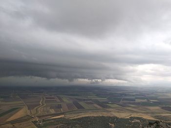 Aerial view of agricultural field against sky