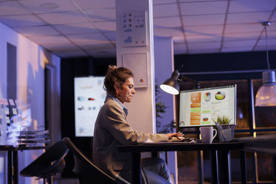 Portrait of young woman working in cafe