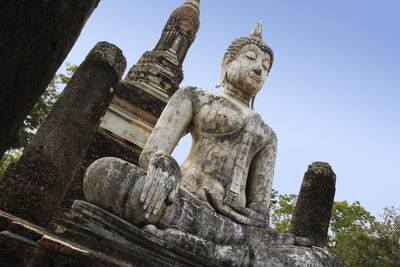 Low angle view of statue against sky