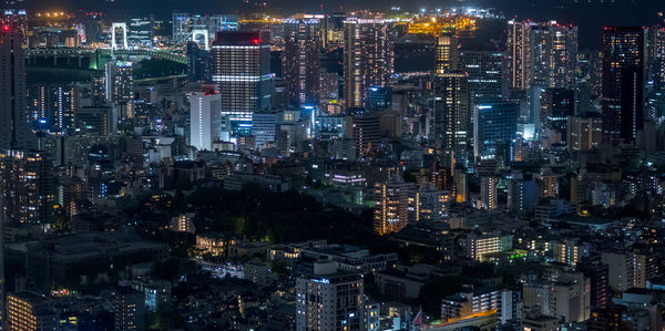 High angle view of illuminated city buildings at night