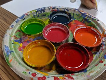 High angle view of various watercolor paints on table