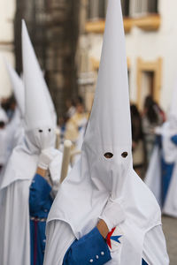 People wearing masks during traditional ceremony