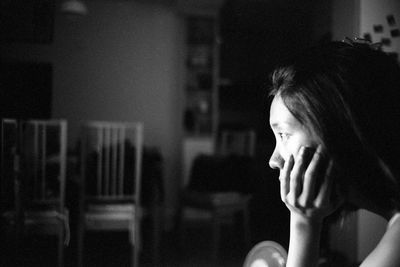 Close-up of tensed woman at home