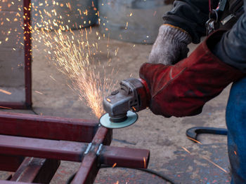 Close-up of worker welding metal