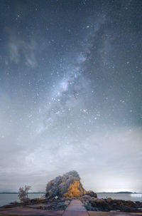 Scenic view of star field against sky at night