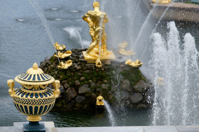 Close-up of statue against fountain