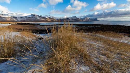 Scenic view of snowcapped mountains against sky