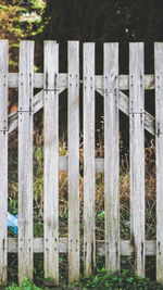 Close-up of wooden fence on field