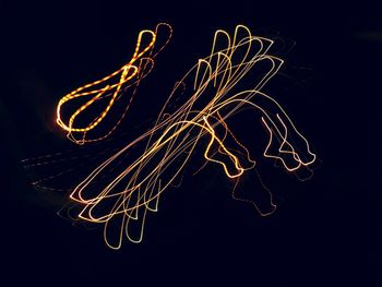 Firework display against sky at night