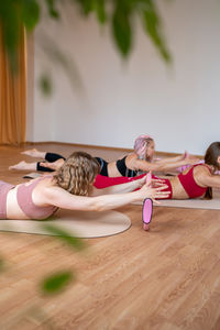 Portrait of young woman exercising in gym
