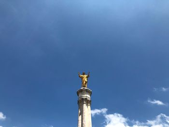 Low angle view of statue against sky