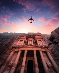 Low angle view of historical building against sky during sunset