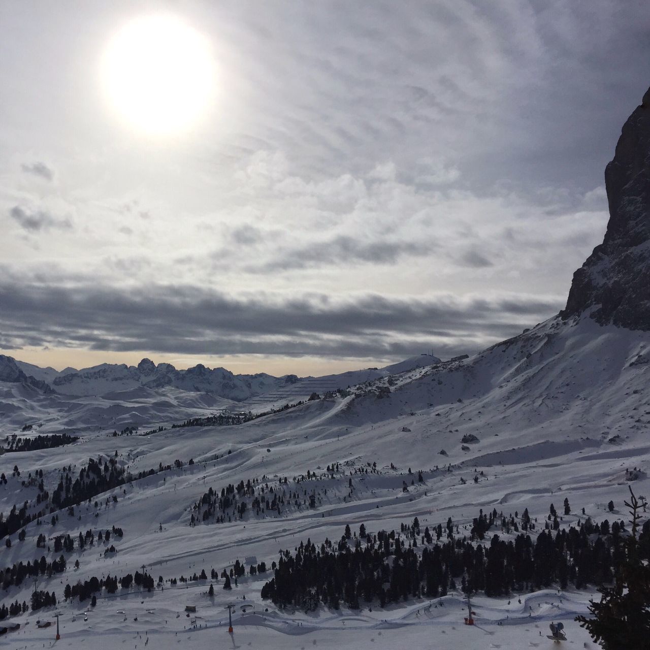 sky, mountain, tranquil scene, landscape, tranquility, scenics, sun, cloud - sky, beauty in nature, mountain range, sunlight, nature, sunbeam, cloud, lens flare, non-urban scene, cloudy, snow, idyllic, outdoors