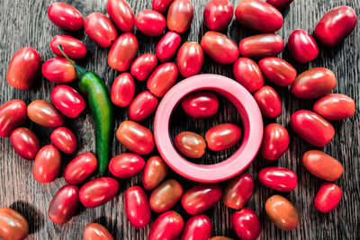 High angle view of fruits and chili pepper on table