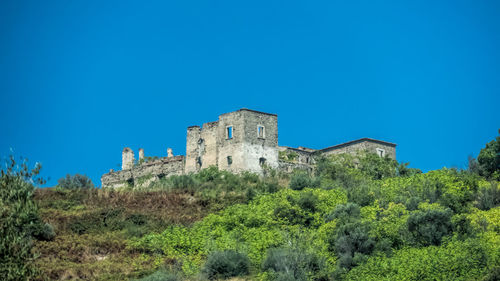 Old ruin against clear blue sky