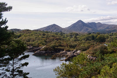 Scenic view of lake and mountains against sky