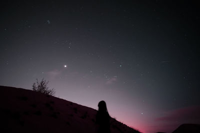 Low angle view of sky against star field at night