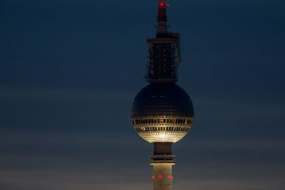 Low angle view of illuminated fernsehturm against sky at night