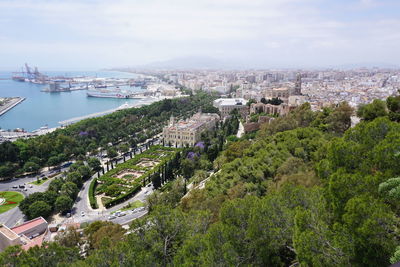 High angle view of buildings and trees against sky