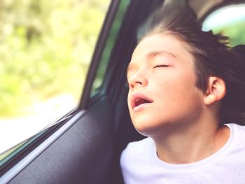 Close-up of boy in car