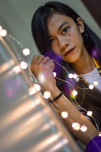 Portrait of young woman looking away