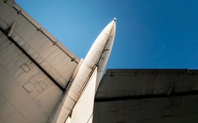 Low angle view of building against clear blue sky