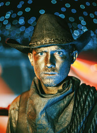 Close-up portrait of man wearing hat