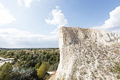 Rock formation on land against sky