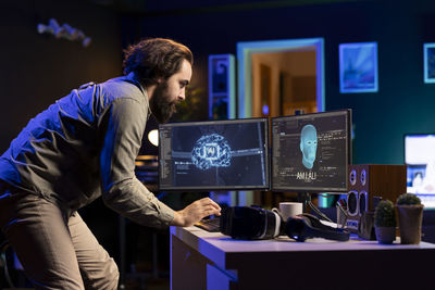 Side view of man working in office