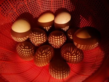 High angle view of chicken eggs in red container