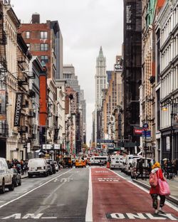 City street amidst buildings against sky