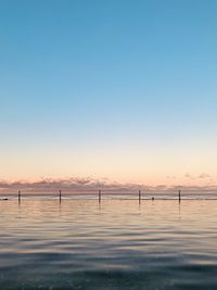 Scenic view of sea against clear blue sky